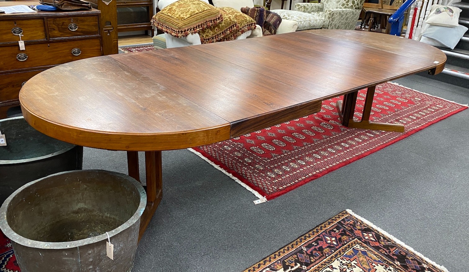 A mid century Danish design Indian rosewood extending dining table, 308cm extended, three spare leaves, width 129cm, height 72cm